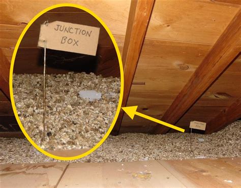 blown-in insulation around electrical boxes|buried electrical boxes in insulation.